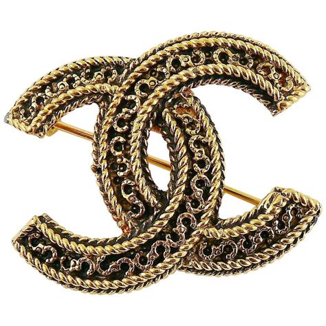 vintage gold chanel brooch|Vintage Chanel brooches.